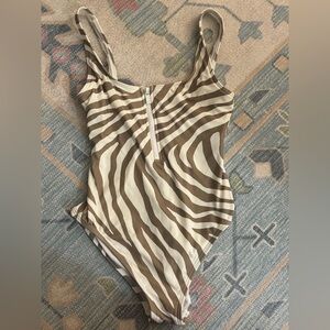 This is the cutest one piece. EUC. Not sure it was worn at all